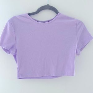 Light purple cropped shirt.